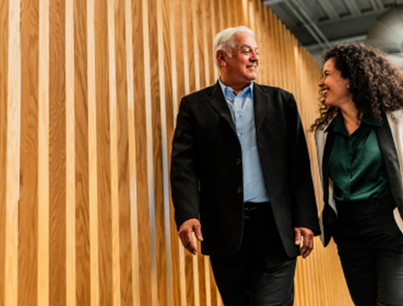 Two people walking and having a discussion.