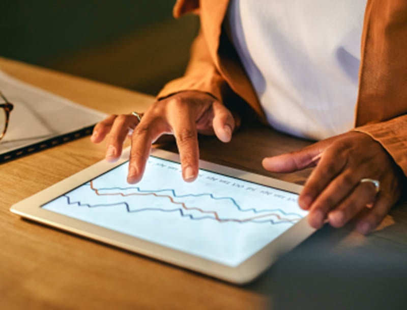 Someone reviewing finances on their tablet.