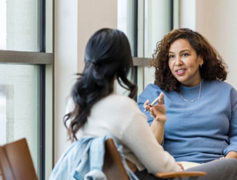 Two women having a conversation.