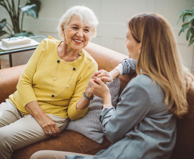 Two generations of woman sitting together.