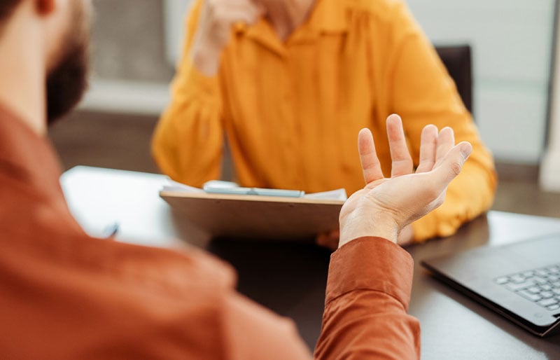 An advisor and client having a discussion.