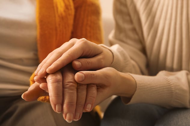 Two people holding hands.