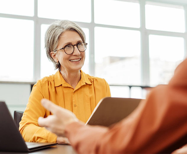 Image of an an advisor eager to help a client.