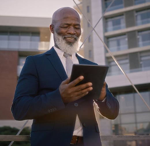 A man reviewing something on his tablet.
