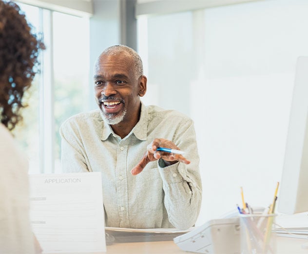 Two people discussing an application.