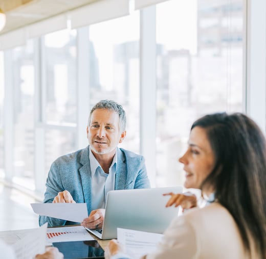 Two people discussing taxes. 